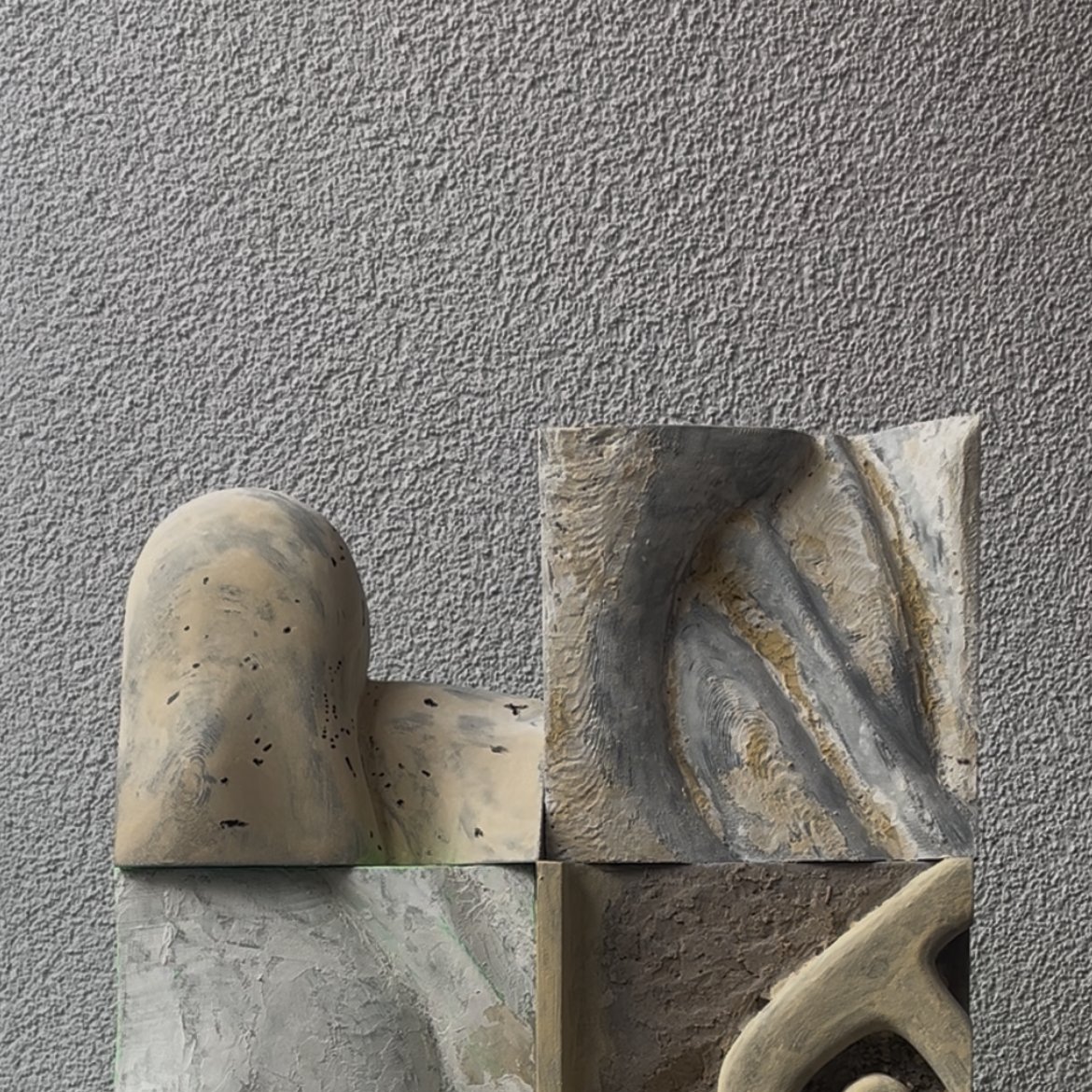 Study I — a stacked sculptural composition of carved, hand-painted blocks in grey and bone tones