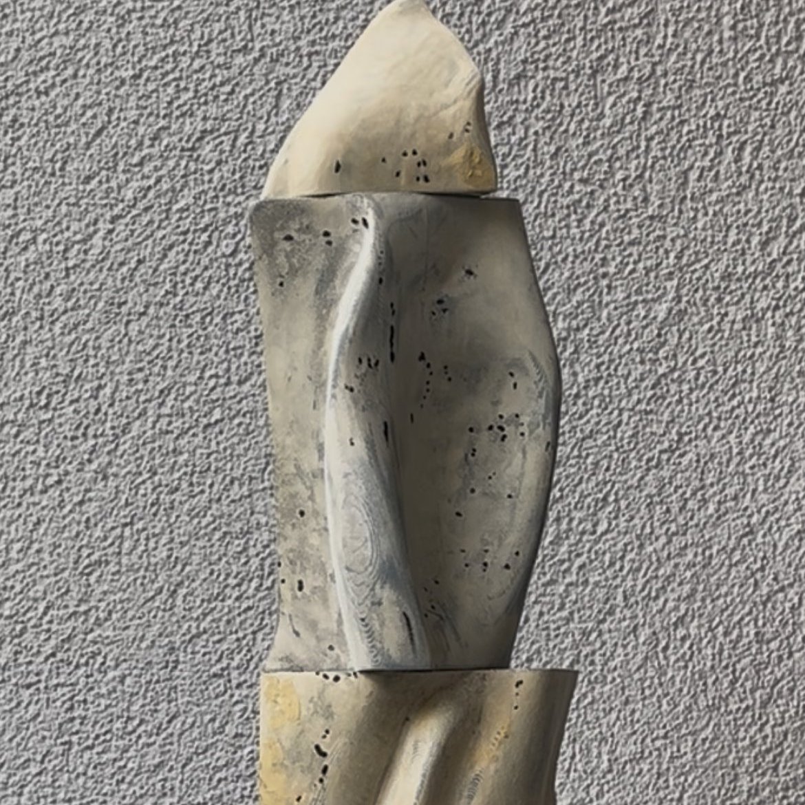 Study II — a tall carved totem-like sculptural form in grey and bone tones