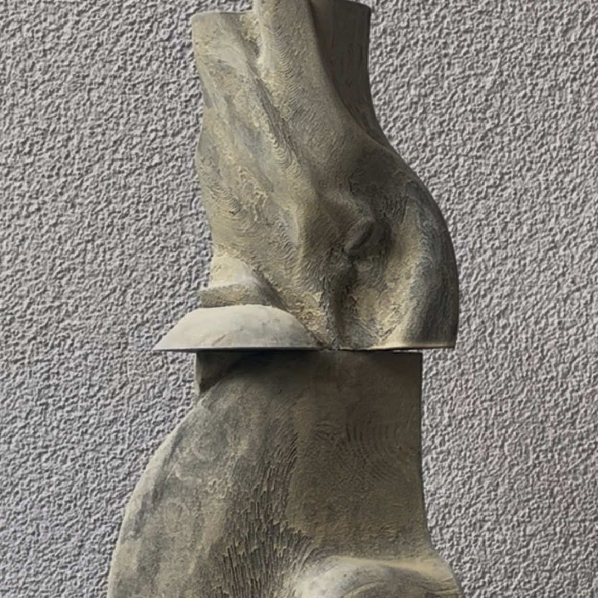 Study III — a carved sculptural form with a draped, folded texture in grey and bone tones